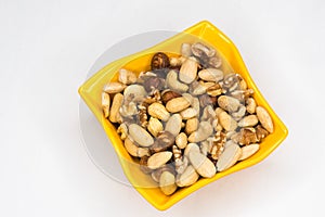 Mixed nuts in  yellow bowl
