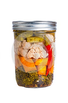 Mixed pickled vegetables in mason jars