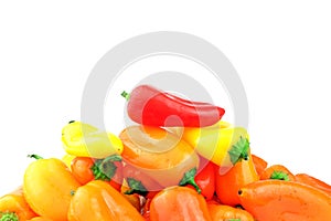 A mixed pile of multi-colored, small, sweet peppers