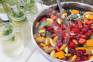 Mixed punch with fruits in metal bowl