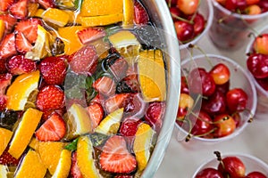 Mixed punch with fruits in metal bowl