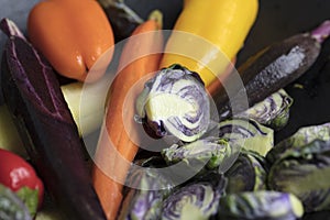 Mixed purple Brussels Spouts, colorful carrots and yellow, red a