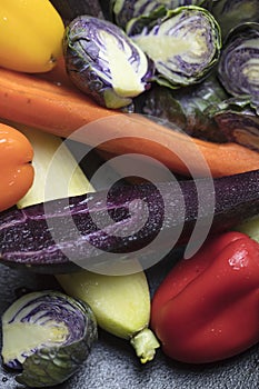 Mixed purple Brussels Spouts, colorful carrots and yellow, red a