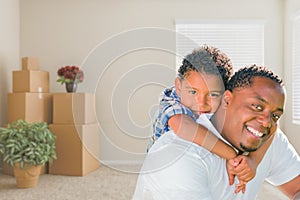 Mixed Race African American Father and Son In Room with Packed M