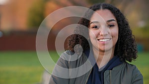 Mixed race African American girl biracial teenager young woman smiling and laughing