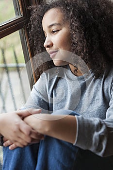 Mixed Race African American Girl Looking Out of Window