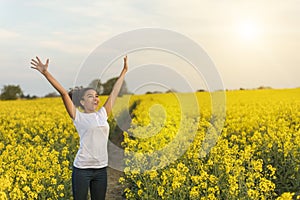 Mixed Race African American Girl Teenager Celebrating In Yellow