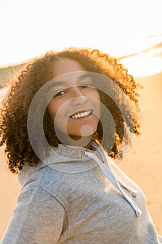 Mixed Race African American Girl Teenager Smiling on Beach at Sunset