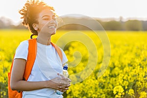 Mixed Race African American Girl Teenager In Yellow Flowers