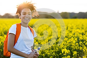 Mixed Race African American Girl Teenager In Yellow Flowers at S