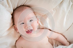 Mixed Race Baby Boy Having Fun on His Blanket