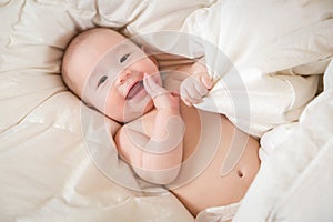 Mixed Race Baby Boy Having Fun on His Blanket