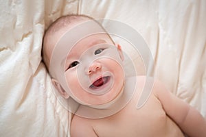 Mixed Race Baby Boy Having Fun on His Blanket