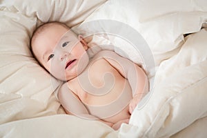 Mixed Race Baby Boy Having Fun on His Blanket