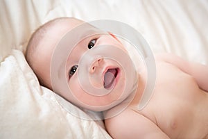 Mixed Race Baby Boy Having Fun on His Blanket