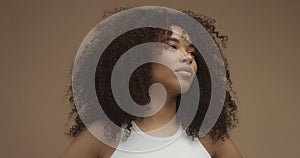 Mixed race black woman portrait with big afro hair, curly hair