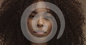 Mixed race black woman portrait with big afro hair, curly hair