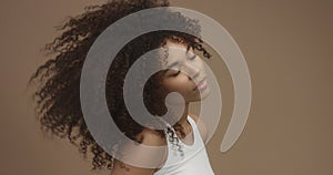 Mixed race black woman portrait with big afro hair, curly hair