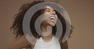 Mixed race black woman portrait with big afro hair, curly hair photo