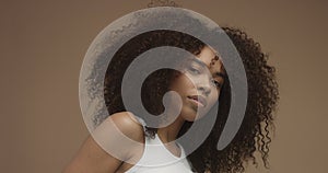 Mixed race black woman portrait with big afro hair, curly hair