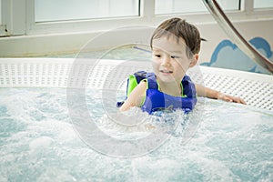 Mixed Race Boy Having Fun at the Water Park