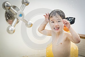 Mixed Race Boy Having Fun at the Water Park