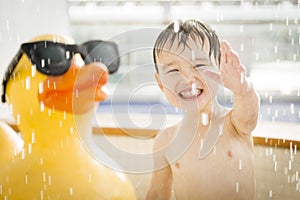 Mixed Race Boy Having Fun at the Water Park