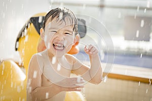 Mixed Race Boy Having Fun at the Water Park