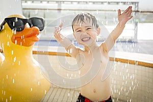 Mixed Race Boy Having Fun at the Water Park