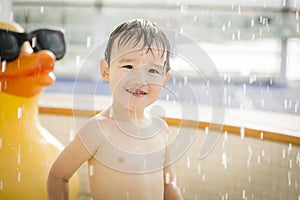 Mixed Race Boy Having Fun at the Water Park