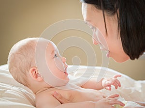 Mixed Race Chinese and Caucasian Baby Boy Laying In Bed with His