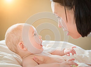 Mixed Race Chinese and Caucasian Baby Boy Laying In Bed with His