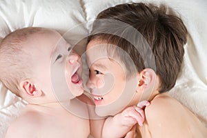 Mixed Race Chinese and Caucasian Baby Brothers Having Fun Laying