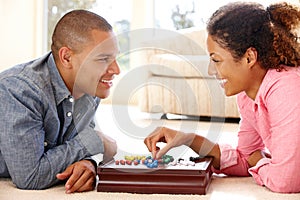 Mixed race couple playing solitaire