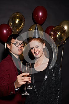 Mixed-Race Couple Posing at Party