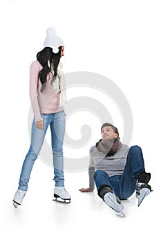 Mixed race couple skating at the skating rink.