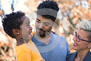 Mixed race couple spending time with their daughter