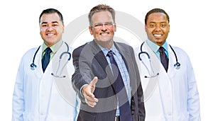 Mixed Race Doctors Behind Businessman Reaching for Hand Shake on