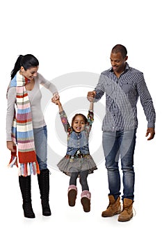 Mixed race family with cute little girl walking