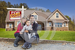 Mixed Race Family Home Sold For Sale Sign photo