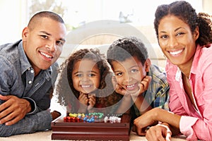 Mixed race family playing solitaire