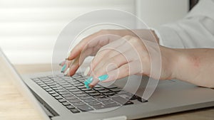 Mixed-race female hands texting on laptop keyboard close up. Busy business woman emailing to client remotely use digital
