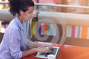 Mixed race female performing business negotiations on video chat. Telecommuting concept.