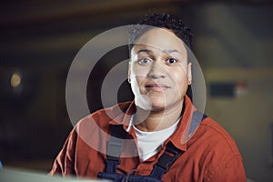 Mixed-Race Female Worker Smiling at Camera