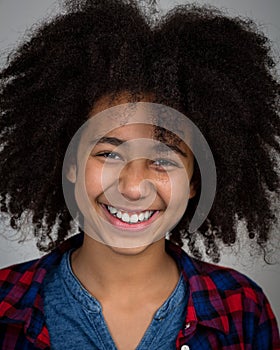 Mixed Race Girl With Afro Hair Style Laughing