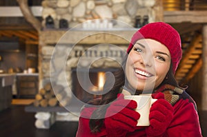 Mixed Race Girl Enjoying Warm Fireplace and Holding Mug