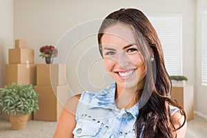 Mixed Race Girl Inside Empty Room wioth Moving Boxes