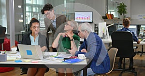 Mixed race group of business people sitting in office