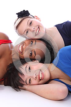 Mixed race happy girls tower of smiling faces