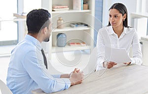 Mixed race hiring manger in interview with businessman. CEO with resume and cv of candidate looking for job opening